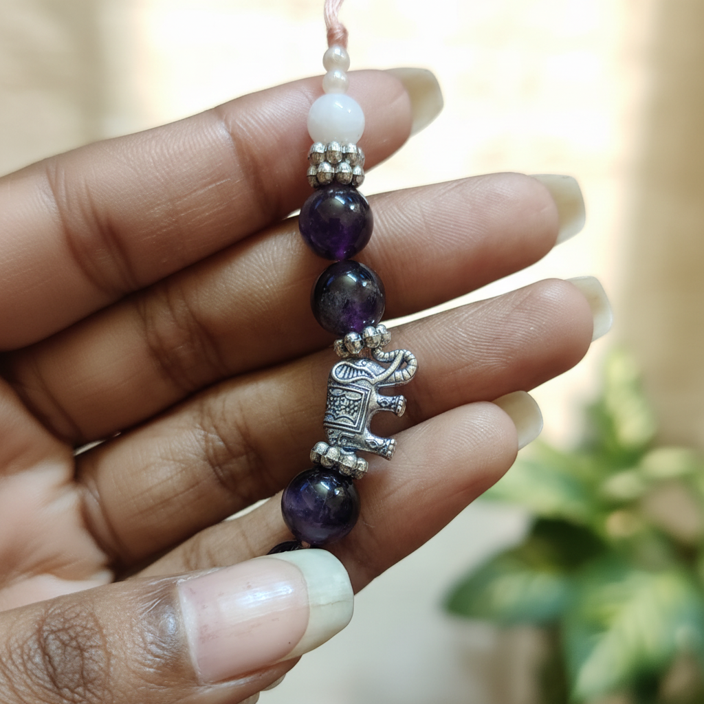 Amethyst Moonstone Elephant Rakhi in Fingers - BG Changed