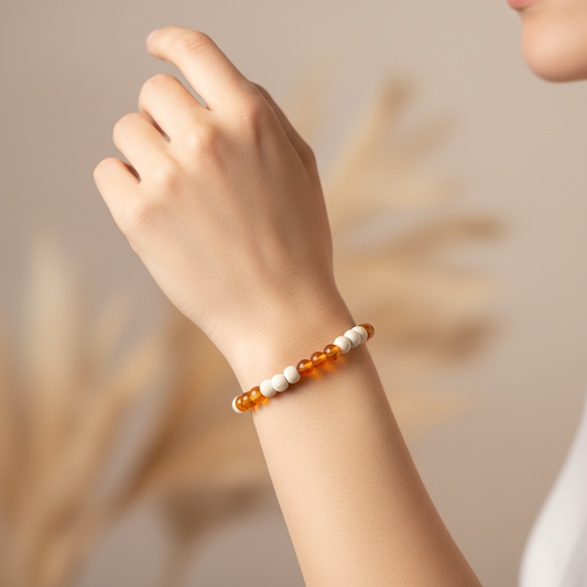 Woman wearing Carnelian and White Howlite bracelet - wrist shot