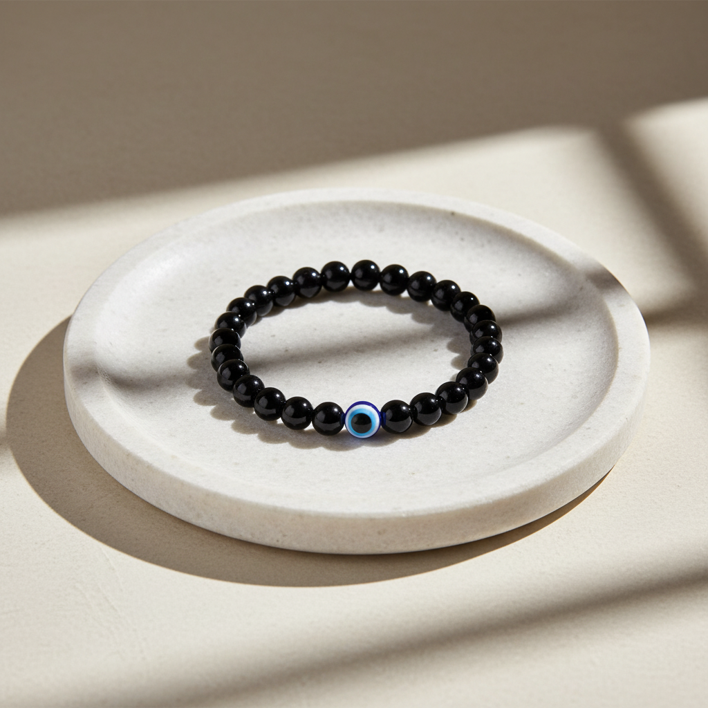 Evil Eye Bracelet with Black Obsidian - On White Stone Plate