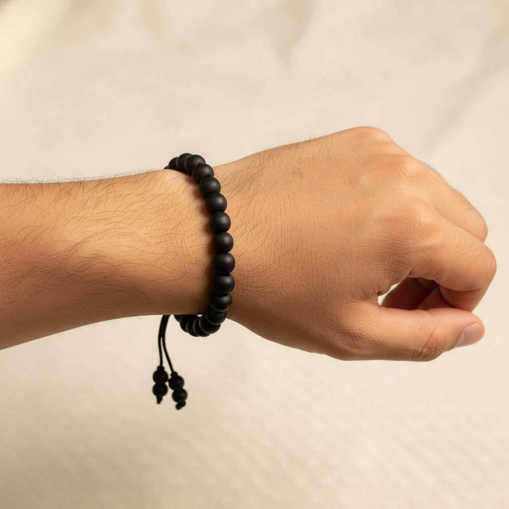 Man Wearing Black Beaded Bracelet - Wrist Shot