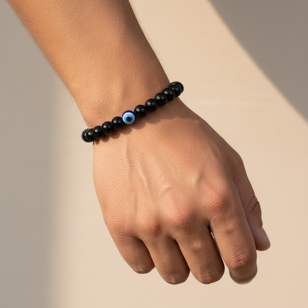 Man Wearing Black Obsidian Evil Eye Bracelet - Wrist Close-Up