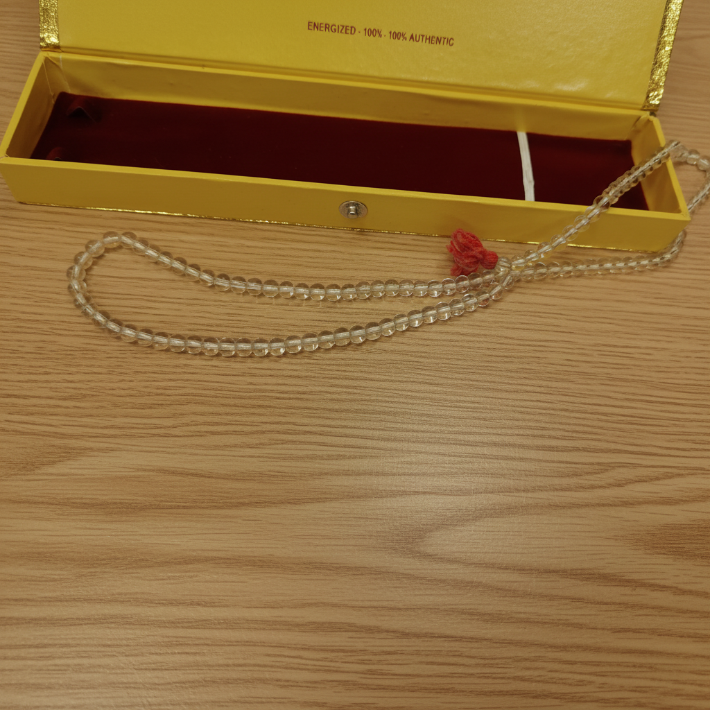 Sphatik Mala Yellow Box Wood Background